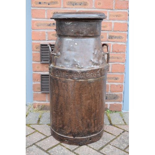 533 - Cadbury Bros Ltd cast metal milk burn with lid, also stamped Cadbury, 73cm tall, with two handles.