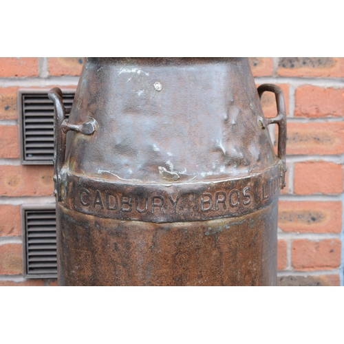 533 - Cadbury Bros Ltd cast metal milk burn with lid, also stamped Cadbury, 73cm tall, with two handles.