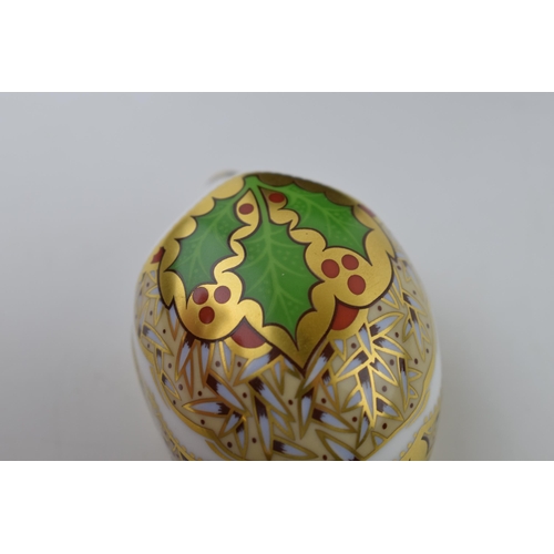 38 - Royal Crown Derby paperweight, Holly Hedgehog, gold stopper and red printed marks on the base, boxed... 