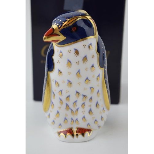 Royal Crown Derby paperweight, Rockhopper Penguin, 21st year anniversary edition with special heptagonal gold stopper, red printed marks and stamp on the base, certificate, boxed.
