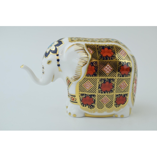 96 - Royal Crown Derby paperweight, Elephant with trunk raised, decorated in the 1128 Imari palette, silv... 