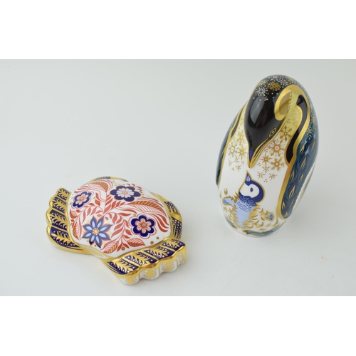 105 - Two Royal Crown Derby paperweights, Penguin and Chick and Crab, 12cm wide, decorated with sea anemon... 