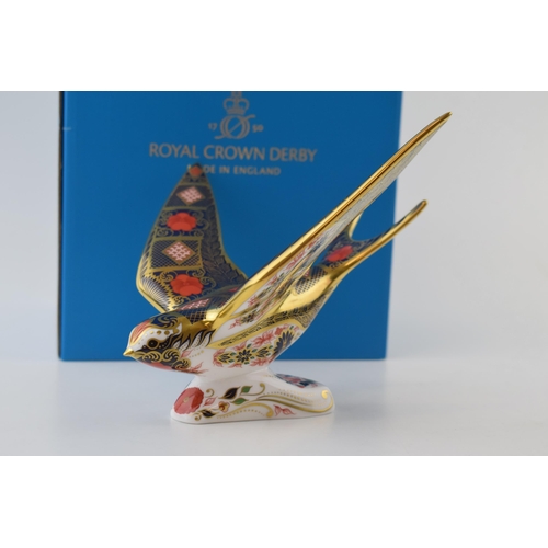 Boxed Royal Crown Derby paperweight, Old Imari Solid Gold Band Swallow, 13cm high, gold stopper and grey printed marks and stamp to underside.