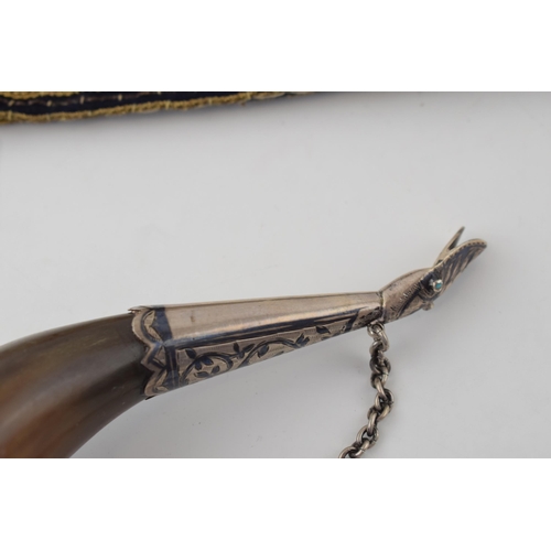 565 - A silver 875 mounted eastern horn with snake-like mouthpiece, 19.5cm long, with a similar origin tea... 