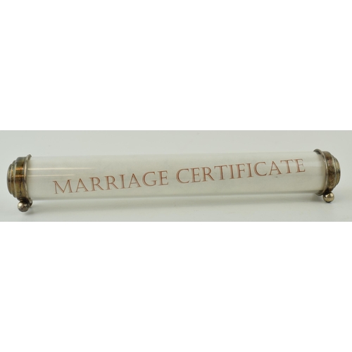 567 - Silver mounted 'Marriage Certificate' holder, perspex tube, with silver ends, on bun feet, Birmingha... 