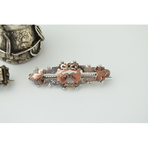 580 - A pair of Victorian or later sweetheart brooches, combined 8.1g, with a silver cased / framed 'Happy... 