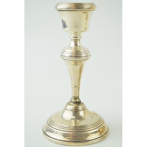 592 - A pair of silver candlesticks, loaded with high shoulder, 14cm tall (2), Birmingham 1952 (both been ... 