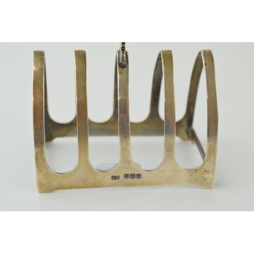 594 - Hallmarked silver 5 bar toast rack, 55.4g, 8cm wide, Sheffield 1931.