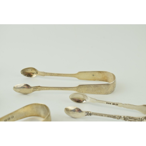 601 - A collection of silver sugar tongs / nips to include Georgian and later examples, 208.5g (6 pairs).