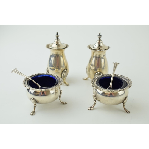 604 - Silver to include a pair of cruets, Birmingham 1914, with a pair of ornate silver table salts with a... 