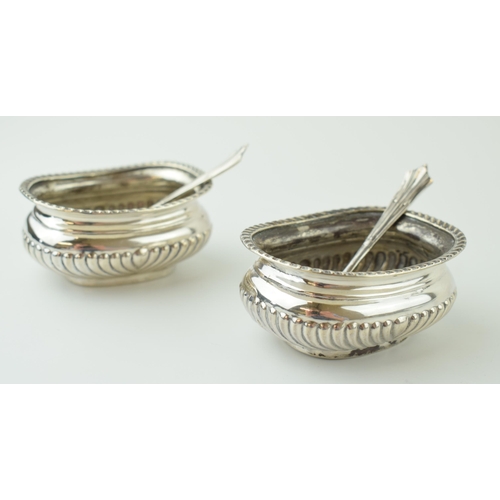 605 - A pair of silver table salts with spoons, without liners, Sheffield 1897, 107.3g.