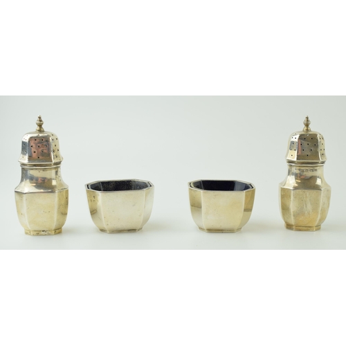 606 - A silver four-piece cruet set to include a pair of salts and a pair of cruets, with liners, Birmingh... 