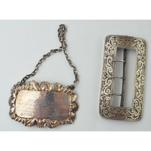 614 - Silver belt buckle with engraved decoration with a silver decanter label, gross weight 33.2g (2).