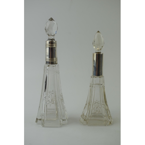 617 - Two silver and cut glass perfume bottles to include one being Birmingham 1921 and the other stamped ... 