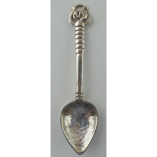 635 - An Arts and Crafts silver spoon, by Winifred King & Co, Birmingham 1934, with a hammered and pointed... 