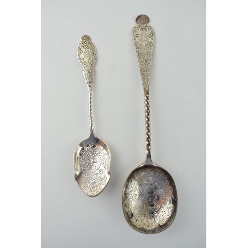 639 - A pair of ornate silver spoons to include a table spoon with engraved bowl and handle, London 1892, ... 