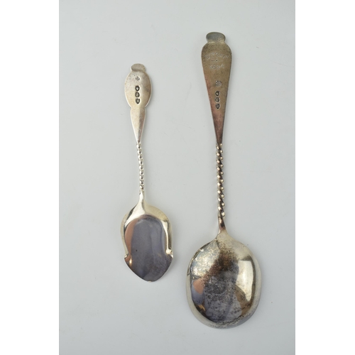 639 - A pair of ornate silver spoons to include a table spoon with engraved bowl and handle, London 1892, ... 