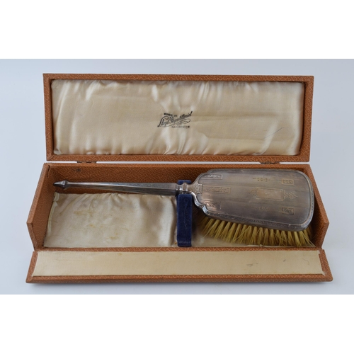 650 - A cased silver brush with traditional design, with a similar hand mirror and Wedgwood Jasperware cuf... 