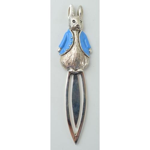 660 - Silver bookmark with Peter Rabbit with blue enamel coat, 7.5cm long.