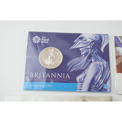 685 - A collection of carded silver coins to include George & the Dragon £20 fine silver coin, 15.71g, 201... 