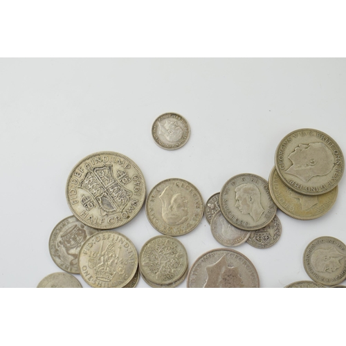 688 - A collection of 1920-1946 silver coins to include a 1921 One Florin piece and others, 233.5g.