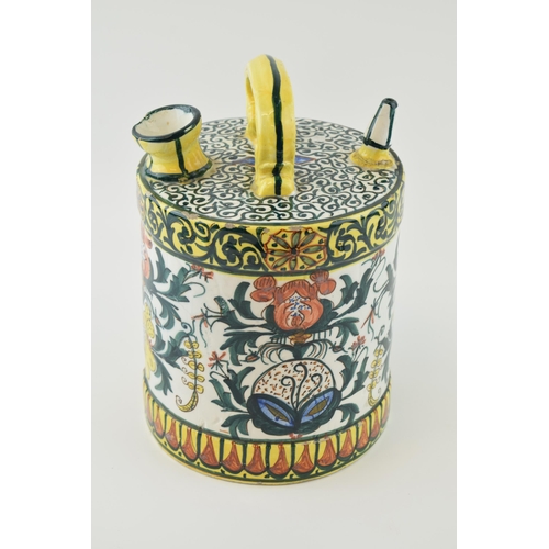 105 - Continental ceramic hand painted vessel with single handle of cylinder form, 26cm tall.