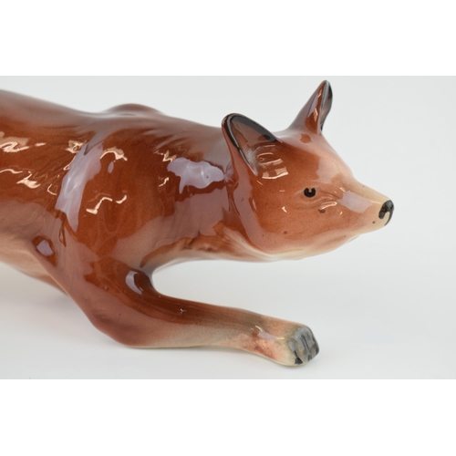 108 - H Wain and sons model of a stalking fox, 33cm long.