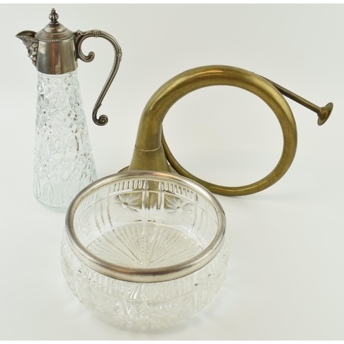 111 - A silver topped bowl hallmarked London, a Baccus plated claret jug together with French horn. Height... 