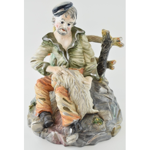 120 - Capo Di Monte figure of a farmer shearing his sheep, 29cm tall.