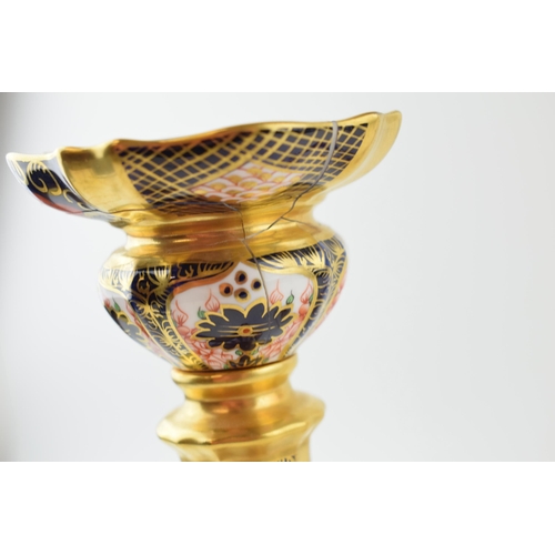 123 - A Royal Crown Derby 1128 Imari tall candlestick, 27cm tall, with a similar Olde Avesbury example (bo... 