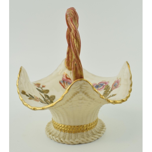 158 - Royal Worcester rope twist handle, with butterflies and flowers, '992', 14cm tall.