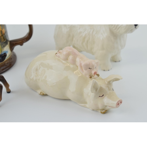 17 - Beswick Westie Dog with a piggy back figure, a brown foal and a Beswick tankard (4).