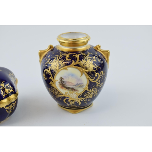 170 - A pair of Coalport hand painted pottery items to include a small vase with a mountainous river scene... 