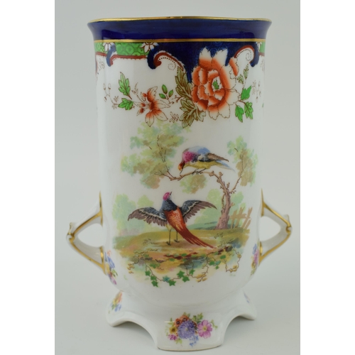 177 - Royal Doulton twin-handled Art Nouveau vase decorated with exotic birds, 17cm tall.