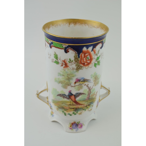 177 - Royal Doulton twin-handled Art Nouveau vase decorated with exotic birds, 17cm tall.