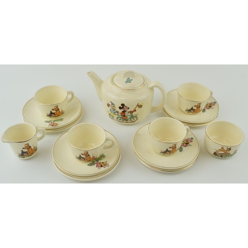 18 - Beswick Disneyland childs teaset to include a teapot, 4 trios, a milk jug and a sugar bowl (Qty).