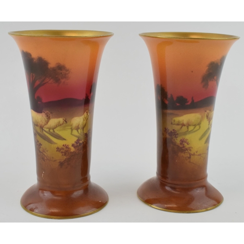 190 - A pair of Royal Doulton sunset sheep vases, (2), 13cm tall, 1 with damages.