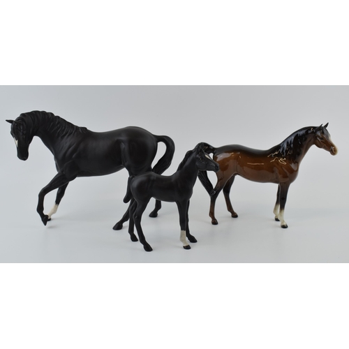 26 - Beswick to include Black Beauty and Foal with a brown xayal (3).