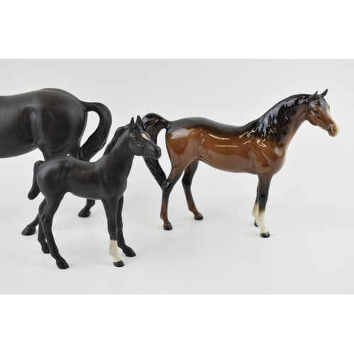 26 - Beswick to include Black Beauty and Foal with a brown xayal (3).
