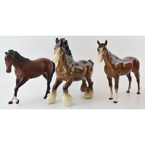 35 - Beswick to include a brown cantering shire, a brown imperial and a matte brown spirit (3).