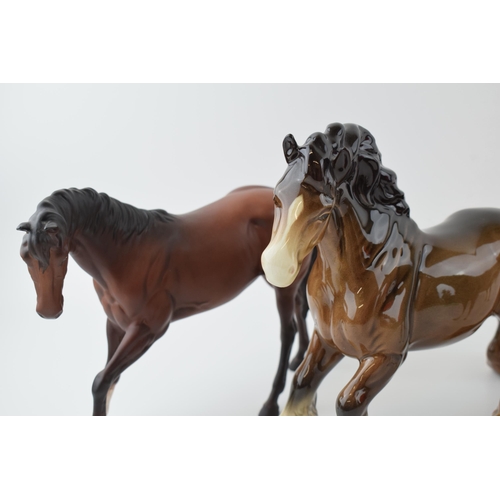 35 - Beswick to include a brown cantering shire, a brown imperial and a matte brown spirit (3).