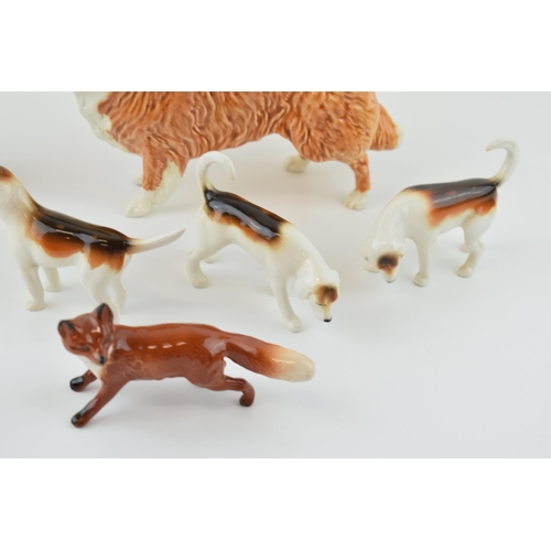 37 - Beswick to include four foxhounds, a fox, a rough collie and another dog (7).