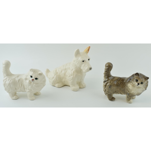 49 - Beswick to include a Scottie Dog 286, with a pair of Persian Cats 1898, one in grey and the other in... 
