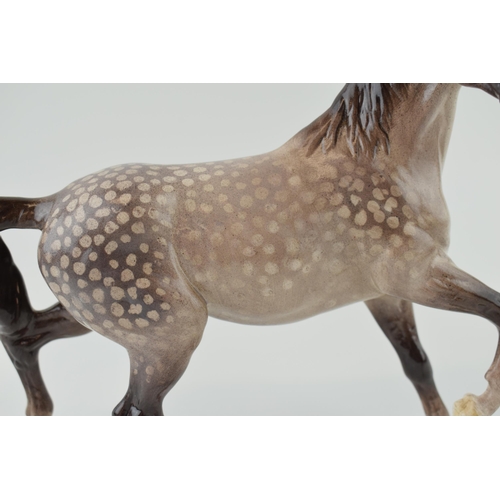 50 - Beswick Spirit of the Wind, with later outside factory decoration, in dappled grey / rocking horse g... 