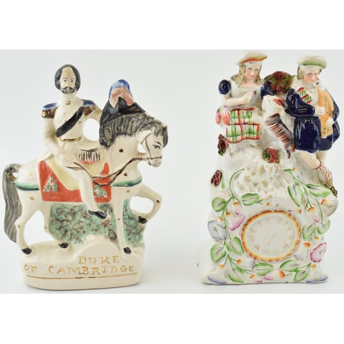 76 - A pair of Staffordshire flatbacks to include a Scottish couple with a goat above a clock and the Duk... 