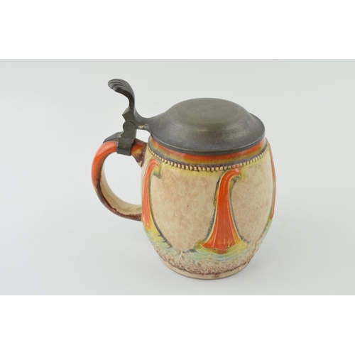 86 - Dumler and Breiden Art Nouveau pottery tankard with pewter lid, 15.5cm tall.