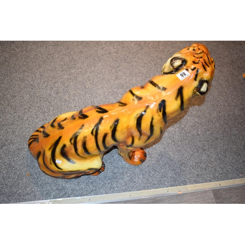 88 - A large mid-century fireside ceramic Tiger. Height 52cm. Width 65cm.
