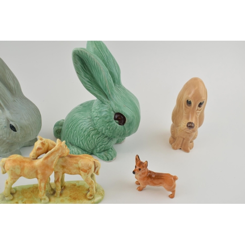 109 - A collection of Sylvac ceramic items to include dogs and rabbit together with a Sylvac style rabbit ... 