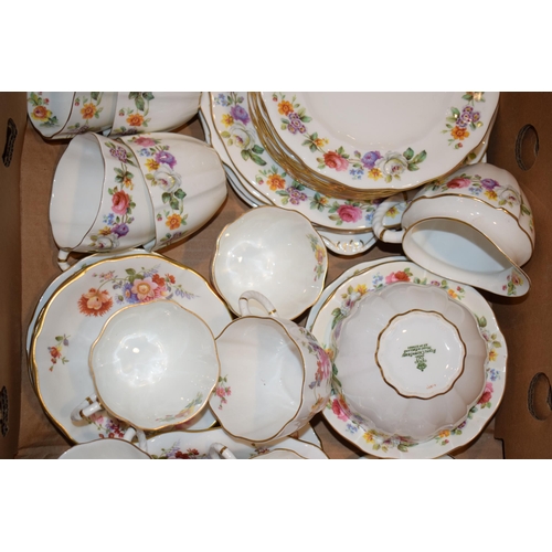 128 - Royal Crown Derby tea ware in a floral pattern to include cups, saucers, cake plates and others (Qty... 