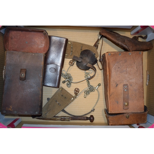 309 - Mixed collection of military items to include cavalry spurs, saddle bags, leather gun holster, epaul... 